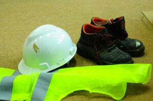 Workers wearing required personal protective gear